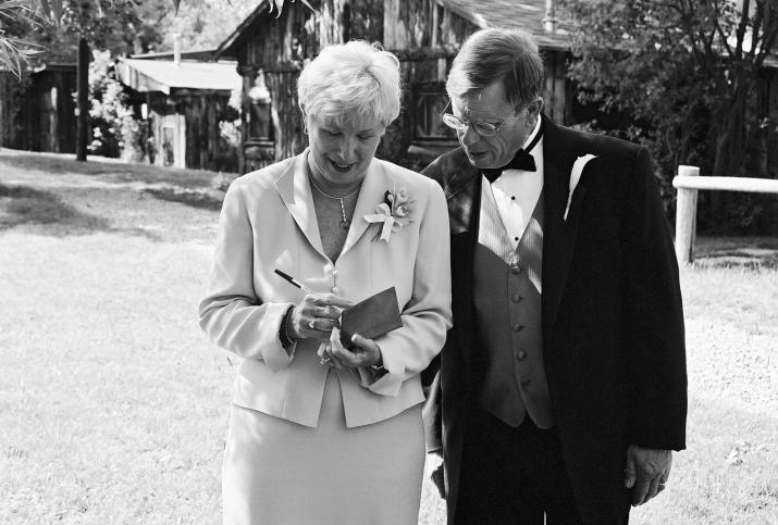 Jane and Bill paying the bills! - Laurie & Mikes Wedding - HF Bar Ranch Saddlestring, Wyoming